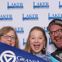 Family of three posing together